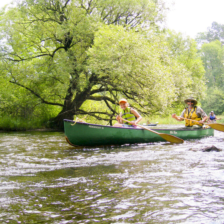 Participants canoeing in the Veteran's Paddle event on the Namekagon River